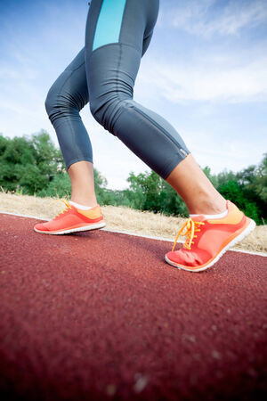 Runner feet running on road,woman fitness and welness concept. Closeup of A Women's Running Shoe の写真素材