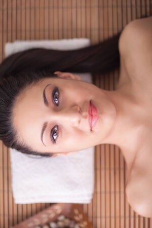 young woman in spa salon relaxingの写真素材