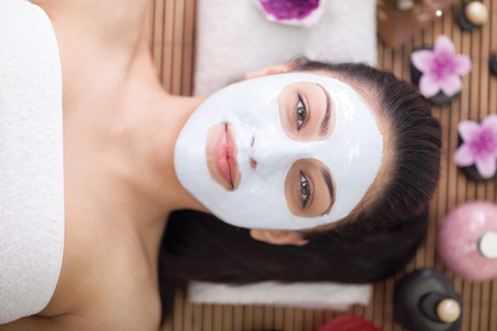 woman having facial mask at beauty salonの写真素材