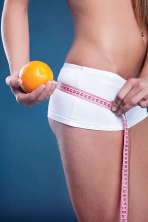 Beauty female body with orange. Healthy lifestyle conceptの写真素材
