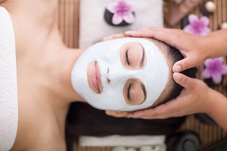 woman having facial mask at beauty salonの写真素材