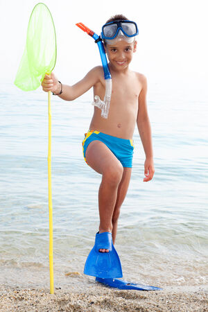  child with diving equipment on the beach,sea ââin the backgroundの写真素材