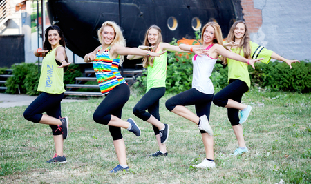 young beautiful woman perform dance training in sunny dayの写真素材