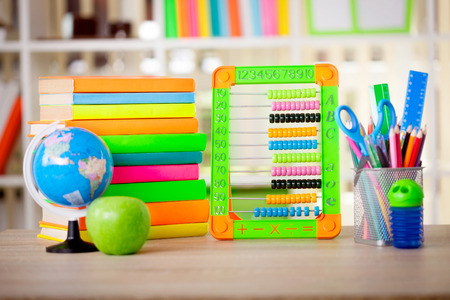 Globe, notebook stack and pencils. Schoolchild and student studies accessoriesの写真素材