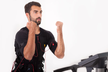 man working on electro muscular stimulation machine