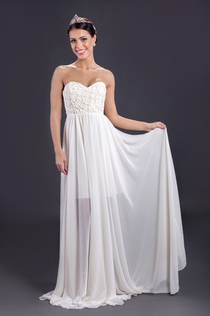 Beautiful elegant young bride in white long dressの写真素材