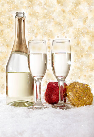 Champagne in glasses on golden background,new year conceptの写真素材
