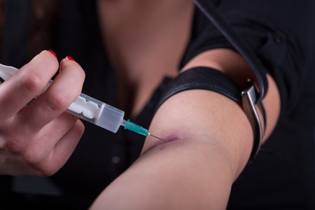 Young woman with drug addictionの写真素材