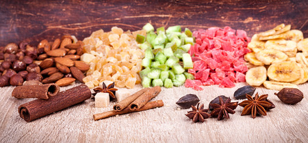 Candied tropical fruits on wooden backgroundの写真素材