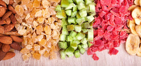 Candied tropical fruits on wooden backgroundの写真素材