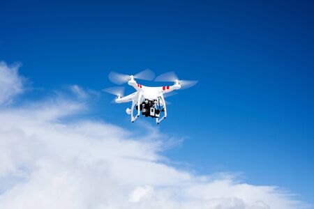 Small drone in the blue skyの写真素材