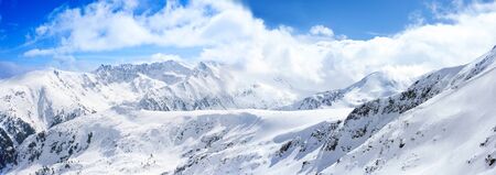 peaks of pine trees covered with snow, wonderful mountain landscapeの写真素材