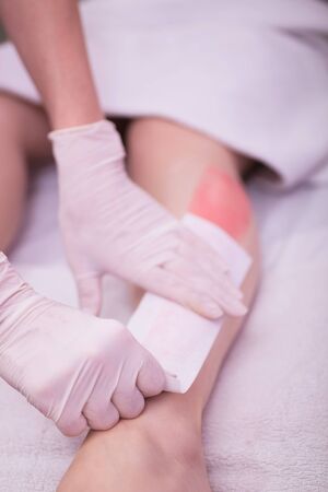 woman depilated legs in beauty salonの写真素材