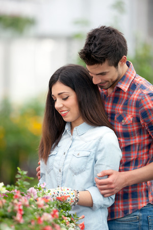 Gardening people, Couple working in greenhouse with flowersの写真素材