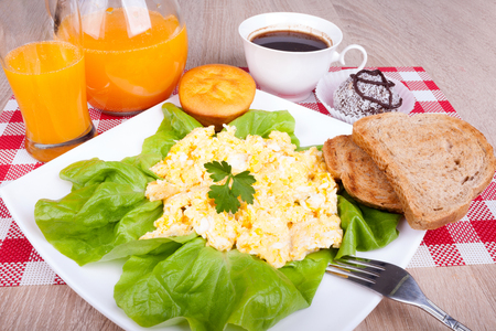 breakfast with scrambled eggs and toastsの写真素材