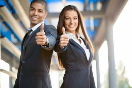 Portrait businessman and woman outdoorの写真素材