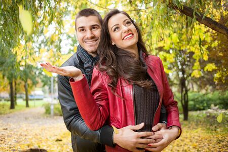 young love couple in autumn parkの写真素材
