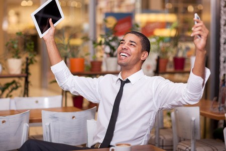 successful  businessman celebrates concluded business  at the restaurantの写真素材