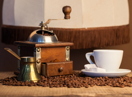 Old coffee pot and mill on dark rustic backgroundの写真素材