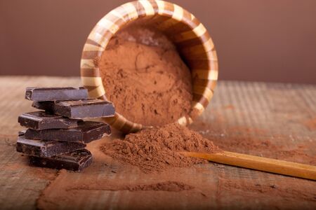 broken dark chocolate  on wooden backgroundの写真素材