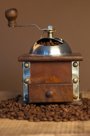 Coffee cup and beans, old coffee grinderの写真素材