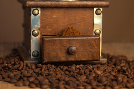 Coffee cup and beans, old coffee grinderの写真素材