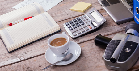 Working desk top view on old tableの写真素材