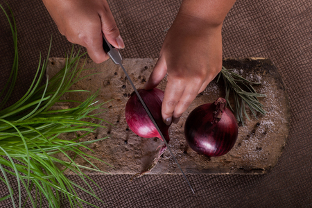 Hand cut red onionの写真素材