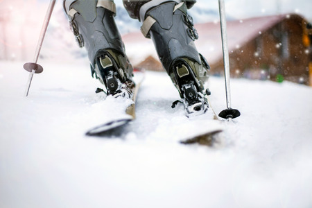 Skier legs skiing on snowの写真素材