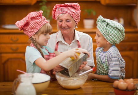 Grandmother with young kids In Kitchenの写真素材