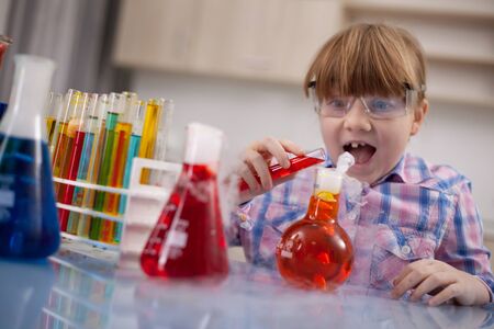 Portrait of smiling schoolgirl in chemistry labの写真素材