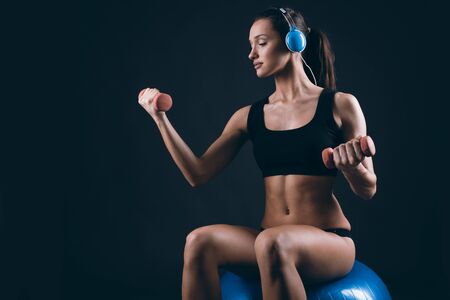 Muscular  strong   fit woman exercisingの写真素材