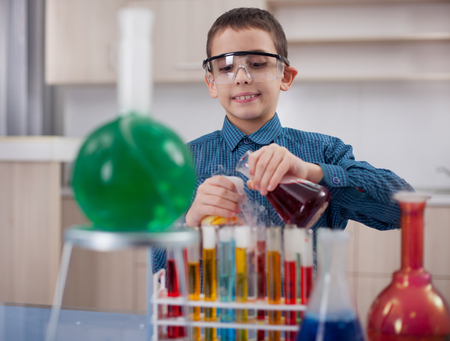 funny scientist boy working in a laboratoryの写真素材