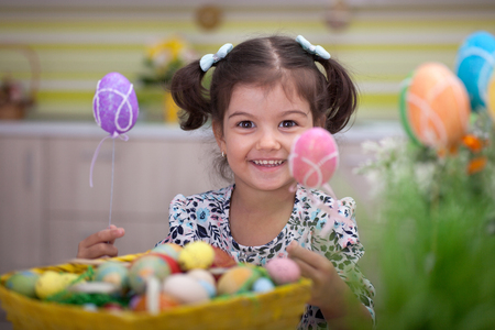 Little girl having fun with  Easter eggの写真素材