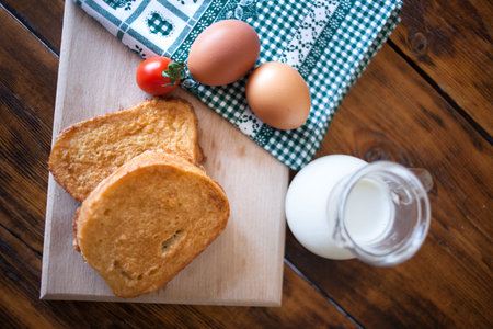 french toast with milk on wooden background
