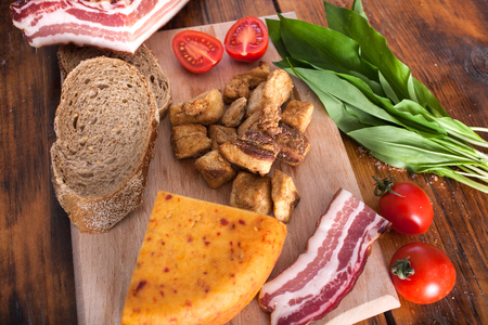 breakfast,salty pork greaves  and cherry tomatoesの写真素材