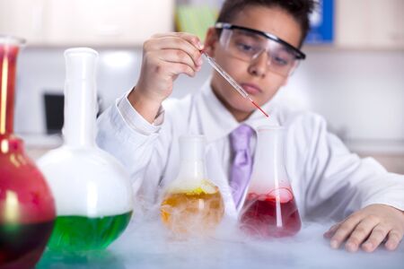 young scientist boy working in a laboratoryの写真素材