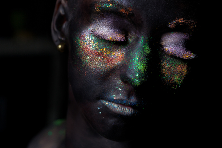 Beauty woman with bright color makeup. Art design, black backgroundの写真素材