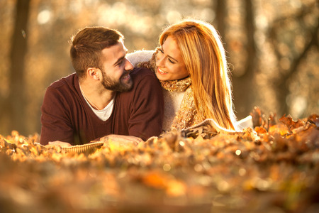 Portrait of a happy young couple enjoying a day in the park togetherの写真素材