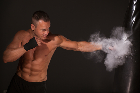 Portrait of boxer posing in studio in glovesの写真素材