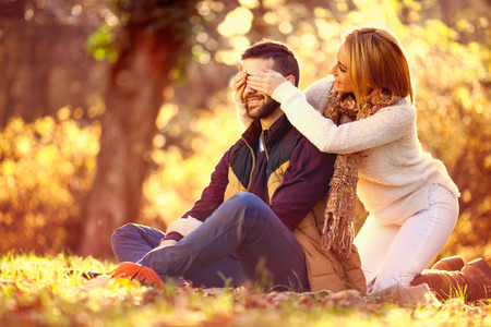 Beautiful couple in love in colorful parkの写真素材