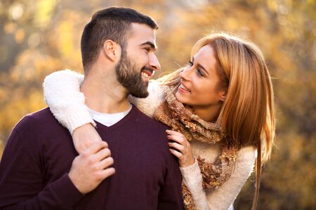 Portrait of a happy young couple enjoying a day in the park togetherの写真素材