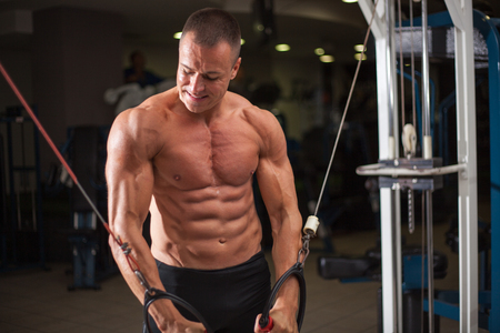 young Athletic man training in gymの写真素材