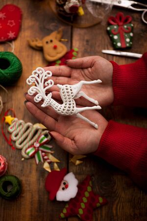 Christmas concept,woman making homemade gifts at homeの写真素材