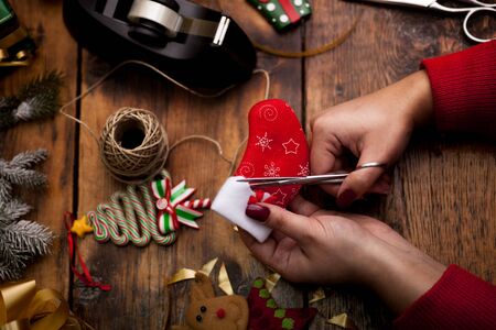 Christmas concept,woman making homemade gifts at homeの写真素材