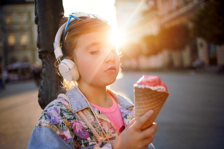 happy girl child listen to the music from her smartphoneの写真素材