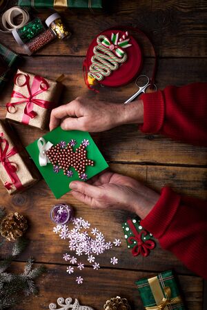 Christmas concept,woman making homemade gifts at homeの写真素材