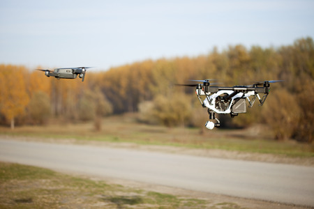 uav drone copter flying with digital cameraの写真素材