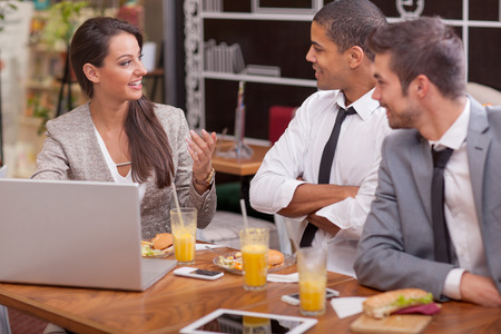 Business people Having Meeting In fast food Restaurantの写真素材