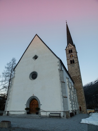 Scuol church in winter time evening  Switzerland の写真素材
